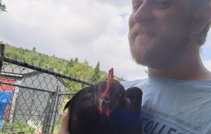 Myself, holding an escaped chicken.