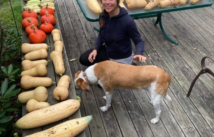 Becca with the squash harvest