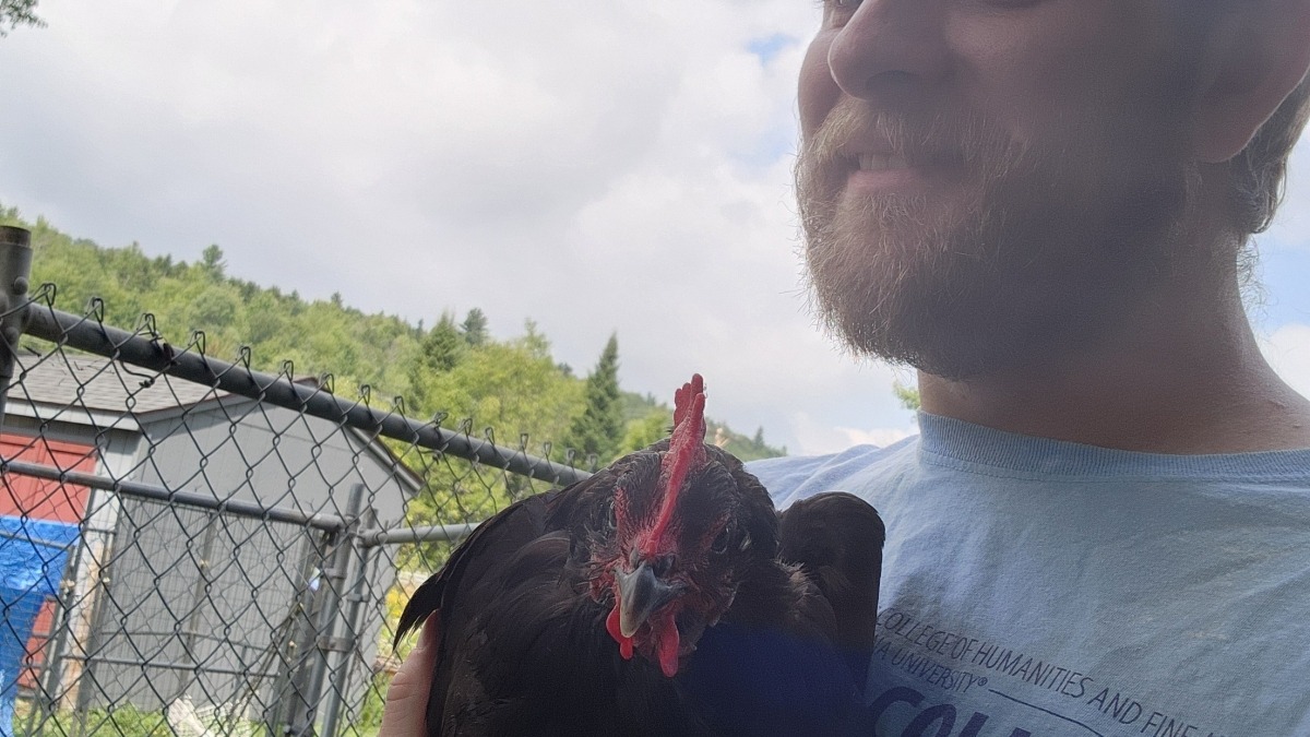 Myself, holding an escaped chicken.