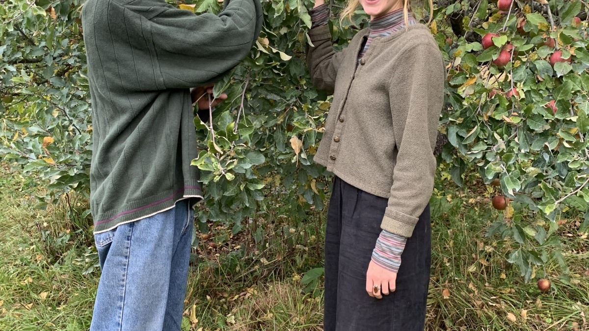 Andy and Via harvesting apples at Lost Nation Orchard.