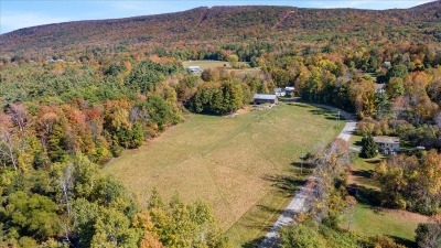 View of pasture, barn, and home