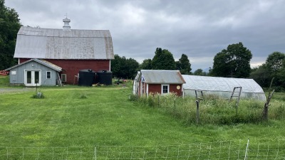10,000 sq.ft. barn, 50'x14' tunnel, fenced-in gardens and multiple raised beds