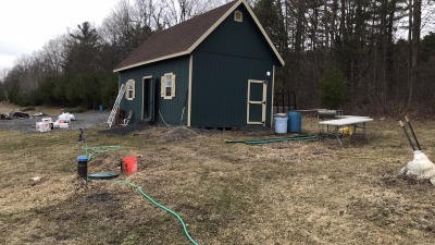 Packshed, parking lot, well