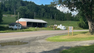 Machine shed & farmstore on W side of Highway 14