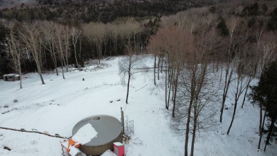 Aerial photo of yurt and down to lower part of property
