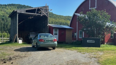 Sawdust shed, creamery entrance, milkhouse entrance, entrance end of barn