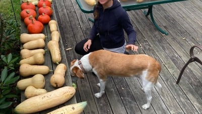 Becca with the squash harvest