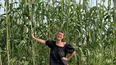 Rose with Sorghum broomcorn she grew for broom-making